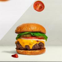 Miss Cheese Burger · Halal beef patty topped with melted cheese, lettuce, tomato, onion, and pickles.