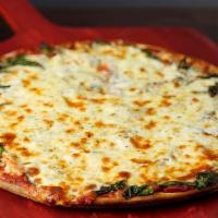 Spinach Classic Pizza · A zesty trio of spinach, garlic and fresh tomato.
