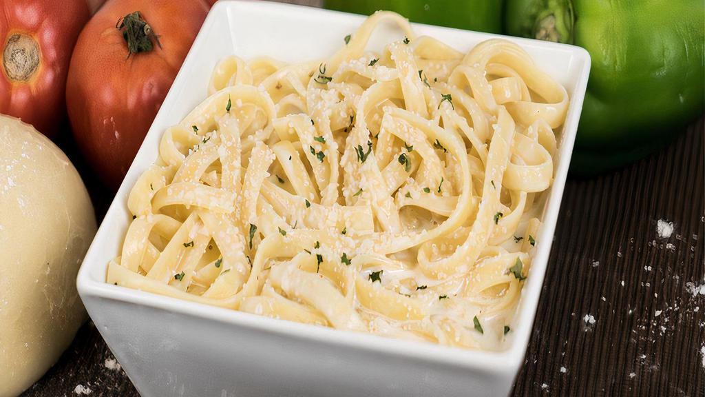 Fettuccine Alfredo · Traditional pasta with Alfredo sauce. A generous portion of pasta, prepared in the old world Italian tradition. Served with garlic bread and grated cheese.