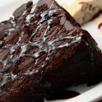Double Dark Chocolate Cake · Moist dark chocolate cake with layers of rich chocolate frosting, topped with our sinful cho...