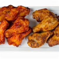 Hot N Spicy Chicken Wings · A full pound of oven-roasted chicken wings baked to perfection and tossed in our fiery buffa...