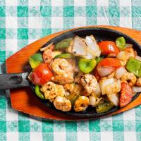 Fajitas Dinners · Marinated chicken, beef strips or shrimp cooked with onions, tomatoes, and green peppers. Se...