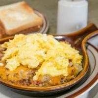 Denver Skillet · We start with hash brown potatoes then add cheddar cheese plus 3 scrambled eggs. Ham, green ...