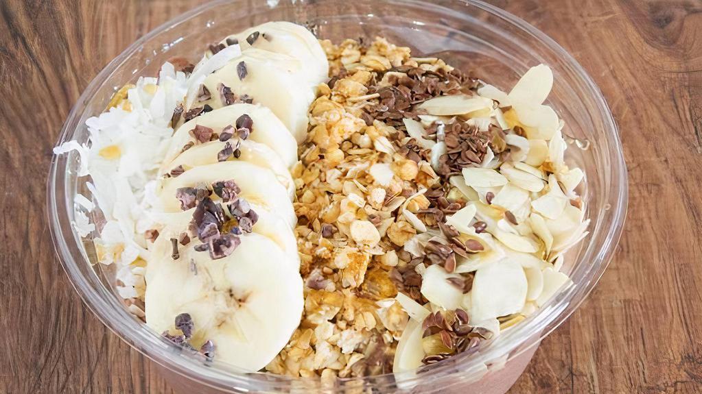 Nutty Professor · Peanut butter, banana, chocolate protein, almond milk, agave.
Toppings: banana, flax seeds, cocoa nibs, almond, coconut, granola, honey.
Granola Base