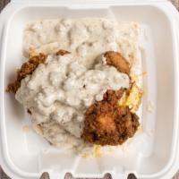 The Brucester · 2 buttermilk biscuits, scrambled eggs, fried chicken breast, topped with sausage and gravy.