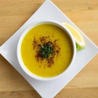 Lentil Soup · Made with red lentils, onions and spices, garnished with lemon, cumin and parsley.