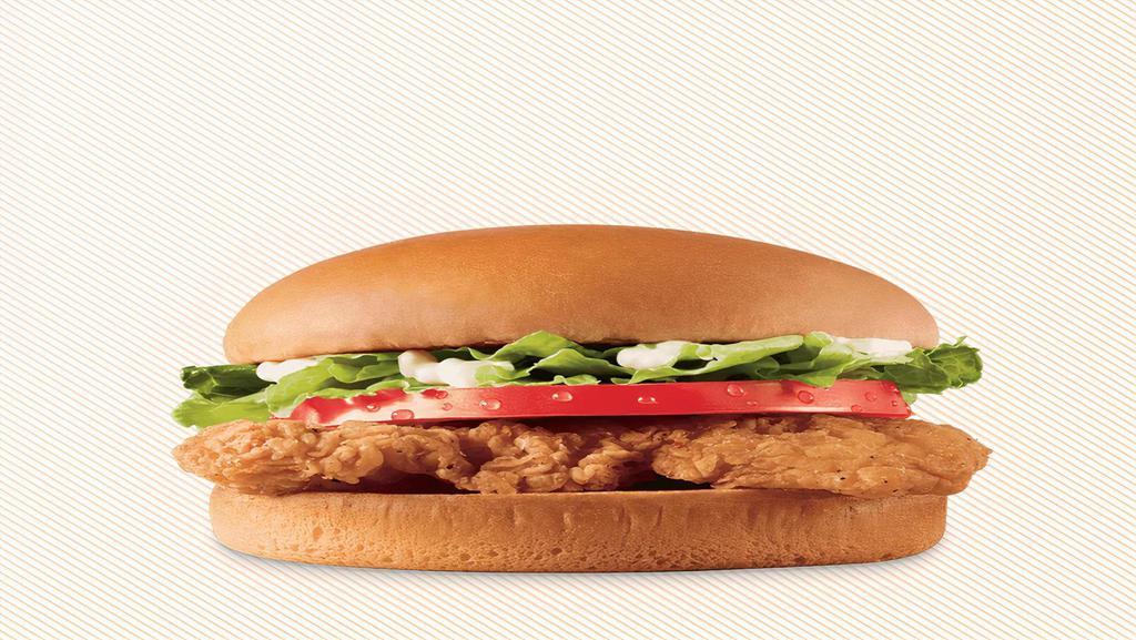 Crispy Chicken Sandwich · A crispy chicken fillet topped with crisp chopped lettuce, thick-cut tomato, and mayo on a warm toasted bun.