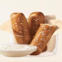 Dq® Bakes!® Pretzel Sticks With Zesty Queso · Soft pretzel sticks, served hot from the oven, topped with salt, and served with warm zesty ...