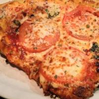 Classic Margherita Pizza · Fresh basil, fresh tomatoes and mozzarella.