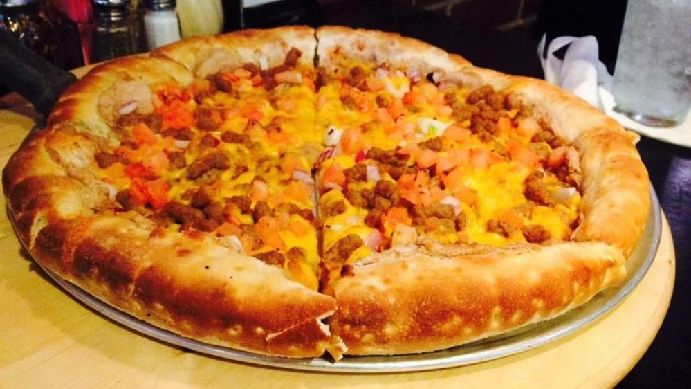 El Taco Pizza · Beef or marinated chicken, refried beans, lettuce, fresh tomato, red onion & cheddar cheese. Served with homemade salsa & sour cream.
