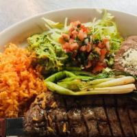 Carne Asada · Gluten free. New York Strip, guacamole, lettuce, lime wedges, pico de gallo, c/f tortillas