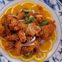Sesame Chicken · Chicken in thin batter cooked with sesame seed and sweet sour sauce.