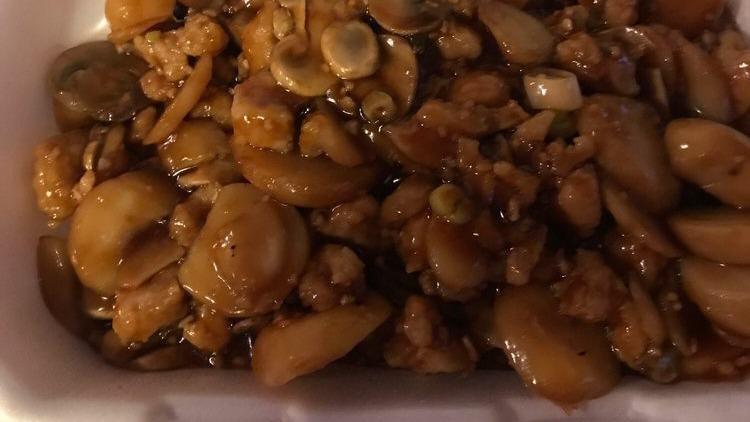 Cashew Chicken · Diced chicken, cashew, celery and bamboo shoot in a brown sauce.
