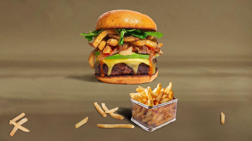 The Face Of French Fries Burger · American beef patty topped with fries, avocado, caramelized onions, ketchup, lettuce, tomato, onion, and pickles. Served on a warm bun.