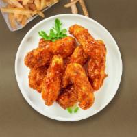 Bbq Boy Tenders · Chicken tenders breaded and fried until golden brown before being tossed in barbecue sauce.