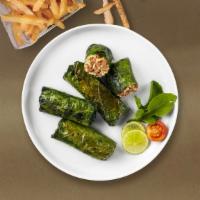 Veggie Grapeleaves · Grape leaves are stuffed with vegetables.