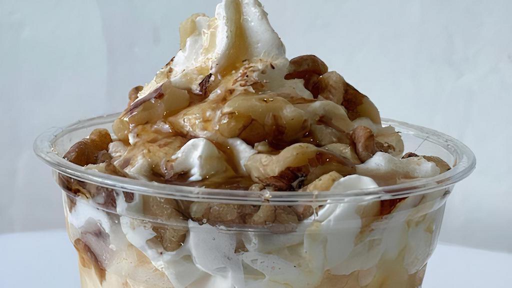 Apple Walnut Sweetie · Vanilla ice cream topped with apple topping, walnuts and maple syrup and a Cinnamon and Sugar sprinkle