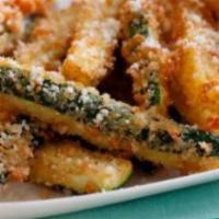 Breaded Zucchini · A generous portion of breaded, seasoned, and deep-fried zucchini slices, served with Ranch d...
