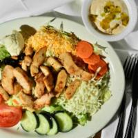 Grilled Chicken Salad · Fresh grilled chicken, sliced and served over romaine and iceberg lettuce topped with mozzar...