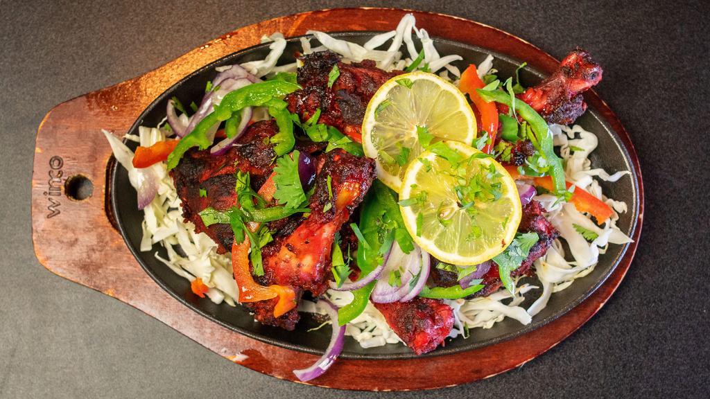 Tandoori Chicken · Gluten-free and nut free. Chicken marinated in yogurt ginger garlic and special in-house spices roasted in a clay oven.