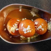 Gulab Jamun · Pastry ball dunked in a sweet syrup.