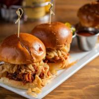 Pulled Pork Sliders · BBQ pulled pork, pork loin, fried pork, and Asian style slaw. Served with BBQ sauce on the s...
