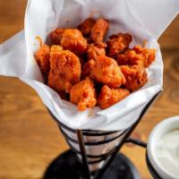 Buffalo Bites · One pound of fried chicken bites tossed in buffalo sauce. Served with bleu cheese on the side.