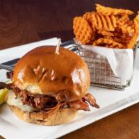 Pulled Pork & Bacon Burger · 10oz burger, topped with BBQ pulled pork, white cheddar cheese, applewood smoked bacon, lett...