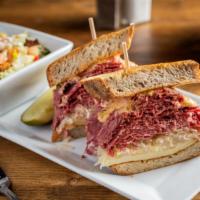 Reuben Burger · 10 oz. burger topped with corned beef, Swiss, sauerkraut, Russian dressing, and rye bun. Inc...