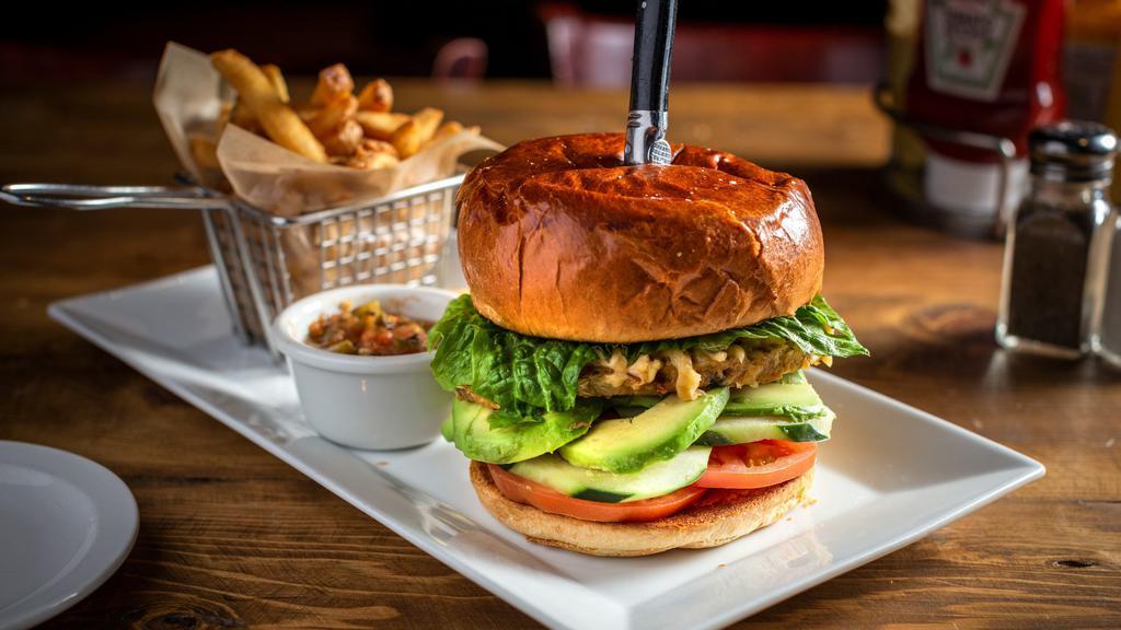 Veggie Burger · Meatless burger, white cheddar, tomato, sliced avocado, cucumber, lettuce, and brioche bun. Served with salsa on the side.