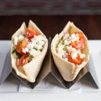 Mediterranean Chicken Pita · Marinated grilled chicken, feta cheese, house made tzatziki, diced red onion, cucumbers, and...