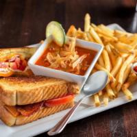 Grown-Up Grilled Cheese Sandwich · Thick cut bacon, tomato, cheddar cheese, provolone cheese, white cheese spread, served on Te...