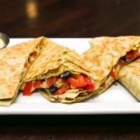 Southwest Quesadilla · Chihuahua cheese, roasted corn, black beans, fire-roasted red peppers, avocado crema, salsa.