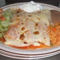 Enchiladas · Three corn tortillas rolled and stuffed with ground beef, chicken or cheese. Covered with ra...