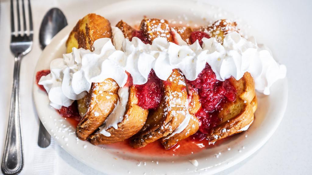 Stuffed French Toast Breakfast Favorite · Zack's French toast combined with our homemade cream cheese based filling. Topped with your choice of fruit topping.