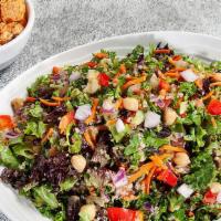 Kale Quinoa Chop · Made with kale/spring mix, quinoa, cucumbers, red onions, diced Roma tomatoes, garbanzo bean...