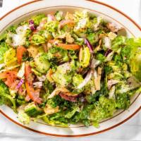 Fattoush Salad · Romaine lettuce, tomato, onion, crisp cucumber, tossed with freshly toasted pita chips, and ...