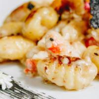 King Crab Gnocchi · potato dumpling, diced tomato, spinach, shaved parmigiana, sliced truffle, fried oyster mush...