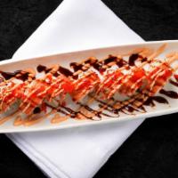 Godzilla Roll · Shrimp tempura and cream cheese, crabstick on the top with spicy mayo, eel sauce and caviar.