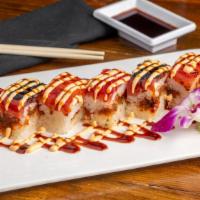 Daruma Roll · Rectangular cut pieces of spicy tuna in the middle, salmon and tuna on the top. Covered with...
