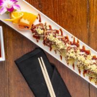 Twilight Roll · Shrimp tempura and avocado, spicy tuna on top with crunchy and eel sauce and tempura flakes.