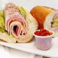Lunchmeat Special · Spiced ham, salami, polish ham, provolone cheese, lettuce, tomatoes, onions, oil and oregano.
