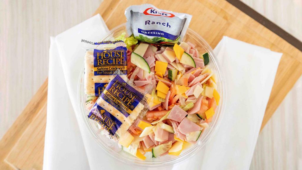 Ham & Cheese Salad · Lettuce, onions, cucumbers, tomatoes, polish ham, provolone, and American cheese.
