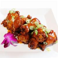 Wings · Add Garlic Parmesan Fries for an additional charge. On-the-bone, Zesty House-made Mango Haba...