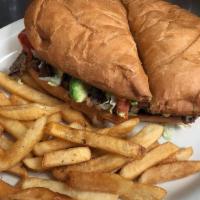 Torta · Your meat choice of: asada, pastor, chorizo, chicken with refried beans, lettuce, tomato, ma...