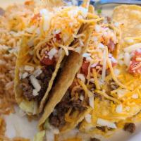 Taco Dinner · Three crispy or soft tacos with shredded Cheese, lettuce and tomato. Served with rice, refri...