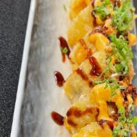 Amazing Roll · Spicy Salmon, avocado cream cheese, Fried tempura, top with Roasted garlic, scallion , Tobik...