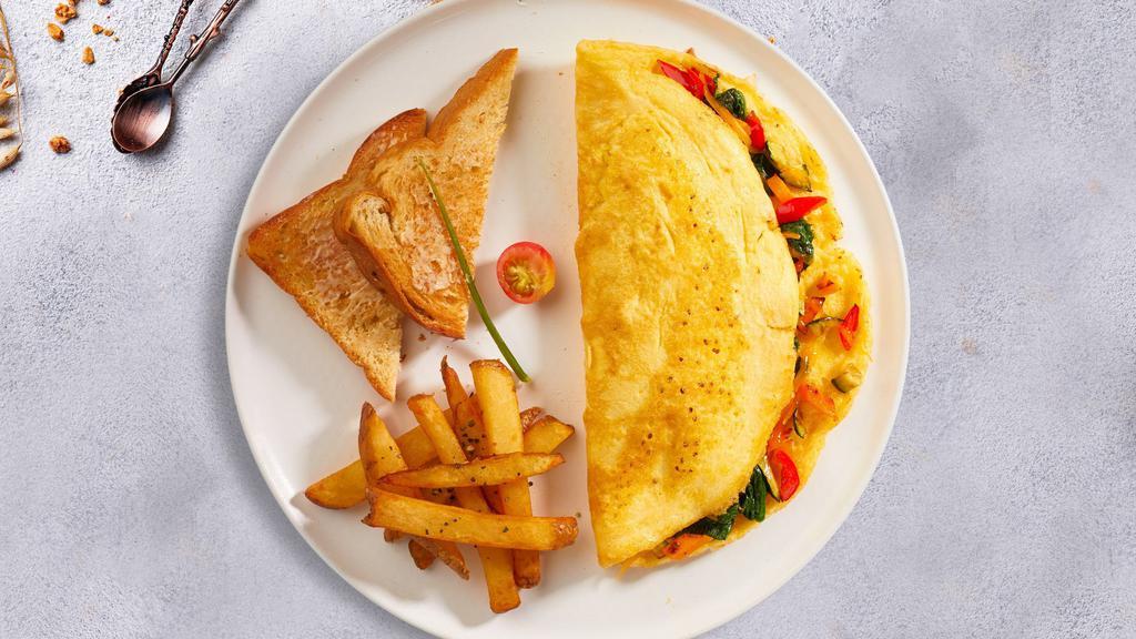 Veggie Omelette · Three eggs, onion, tomato, mushroom and green pepper served with hash brown, toast, and jelly.