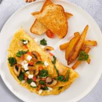 Mushroom Omelette · Three eggs, mushrooms, onions, spinach, tomatoes and cheese served with hash brown, toast, a...