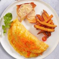 Cheese Omelette · Eggs cooked with loaded cheese as an omelette served with hash brown, toast, and jelly.